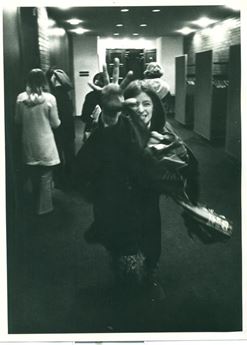 woman holding hand outstretched to camera